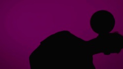 Young male soccer freestyler juggling a ball around his head Stock Footage