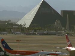 ZO, WS, Passenger jets on tarmac, Luxor Hotel in background, Las Vegas, Nevada, USA Stock Footage