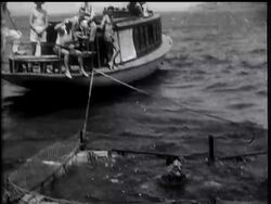 RECORD SWIM - FULLY CLOTHED - News Clip