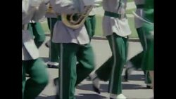 MS Performers marching in parade on street during carnival / United States Stock Footage