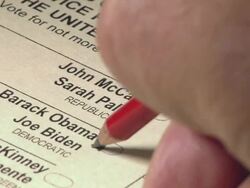 2008 CU hand using pencil to vote for Barack Obama and Joe Biden on US presidential ballot Stock Footage