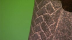 Hash marks decorate the face of an Egyptian statue. Stock Footage