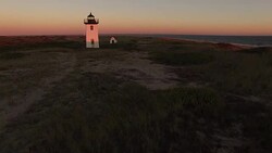 Lighthouse By The Sea At Sunset Stock Footage