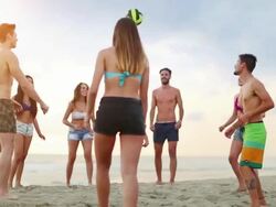 Friends playing volley on the beach Stock Footage