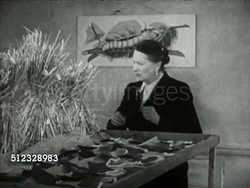 1953: SILK: Angled MS Lullingstone Manor (castle), MS 'Lullingstone Silk Farm' sign, Millicent Zoe Lady Hart Dyke checking silkworm cocoon. REELING ROOM: TD MS Silkworm cocoons floating in water, females working w/ machine, woman adjusting spool Instructional Video