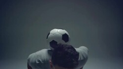 young male soccer freestyler juggles a ball on his neck Stock Footage