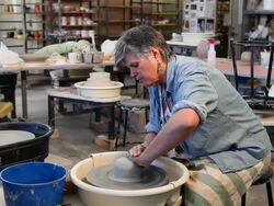 MS Female potter working with pottery wheel in her studio / Santa Fe, New Mexico, United States Stock Footage