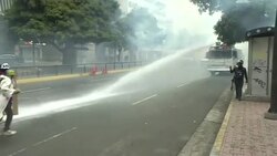 CLEAN : Venezuelan opposition demonstrators clash with police News Clip