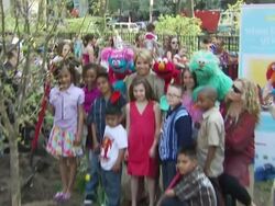 Katie Couric, Elmo and participants at the Katie Couric and Sesame Street Muppets - When Families Grieve at New York NY. (Footage by WireImage Video/GettyImages) Stock Footage