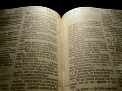 CU Fading in and out on pages of first edition of King James Bible / England Stock Footage