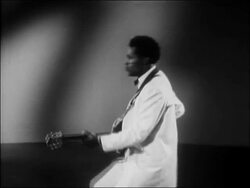 1956 medium shot Chuck Berry doing the 'duck walk' while performing 'You Can't Catch Me' / AUDIO Stock Footage
