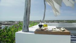 Appetizer on cutting board on luxury patio Stock Footage