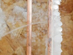 Frozen Cracked Copper Water Pipe Leaking into House Basement Stock Footage