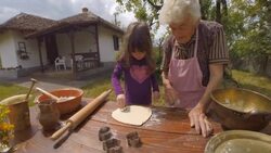 Cooking With Grandma-Beautiful Little Girl Learns How To Make Cookies  in The Bright-lit Vintage Kitchen Stock Footage