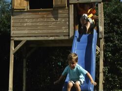 Kids sliding (Shot on Red) Stock Footage