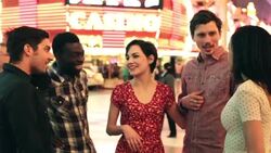 Friends talk and laugh excitedly outside casino in downtown Las Vegas Stock Footage