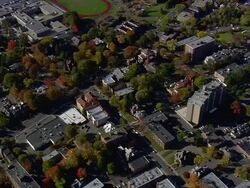 MS AERIAL ZO DS Shot of Mark Twain House surrounded by tree in city / Connecticut, United States Stock Footage