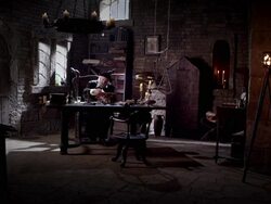 Nostradamus sits a table and reads a book. Stock Footage