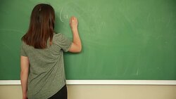 Young student writing math formula Stock Footage