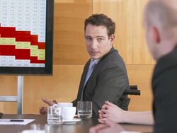 HD: Executive On Wheelchair Giving Presentation Stock Footage