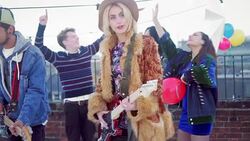 Musicians performing and young friends dancing at urban rooftop party Stock Footage