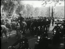 A horse drawn carriage pulls the flag draped casket of United States President Franklin D Roosevelt. News Clip