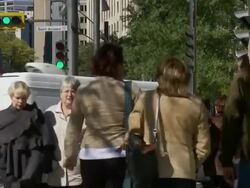 Tilt Down From Directions Signs to University Street With Pedestrians - Back To signs Stock Footage