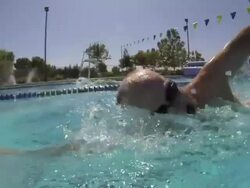 CU Side POV SLO MO Shot of male, baby boomer, swimming freestyle / Davis, California, United States  Stock Footage