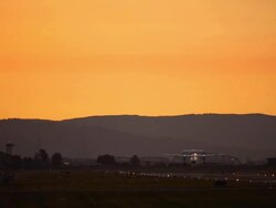 regional commuter aircraft sunset takeoff Stock Footage