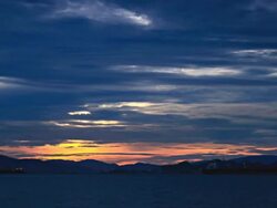 timelapse-Loading cargo ships during sunrise.(zoom in) Stock Footage