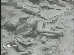 1946: ALLIED OCCUPATION OF INDONESIA: VS Wooden home burning, flames & smoke, Dutch soldier spraying fire w/ water hose. GRAPHIC PHOTO: Dead Indonesian boy. VS Destroyed roads, Indonesian refugees walking, families. Revolution, invasion. Instructional Video