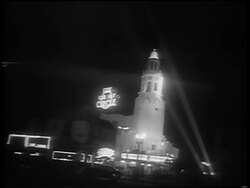 B/W 1959 close up three large klieg lights pointing at sky at Oscars at night Stock Footage