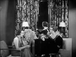 B/W 1931 Hedda Hopper + Norma Shearer sitting in dressing room talking as man enters / feature Stock Footage