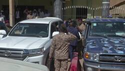 Al-Bashir waves at protesters outside Sudan court Instructional Video