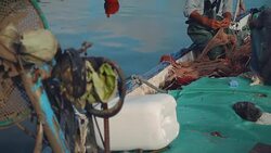 Cleaning the nets at Mediterranean fishing harbor Stock Footage