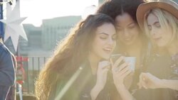 Young women taking selfie at urban rooftop party Stock Footage