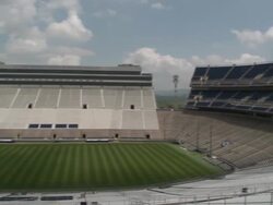 Shot from the top of Beaver Stadium at Pennsylvania State University. Shot pans from end zone to end zone Stock Footage