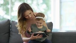 Mother and Baby Girl using a Digital Tablet Stock Footage