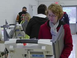 MS Shot of Voters cast ballots at computer terminals during presidential election / Sylvania, Ohio, United States  Stock Footage