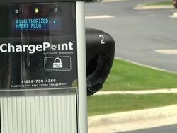 CU Connector being returned to charging port after charging / Rochester, Michigan, United States Stock Footage