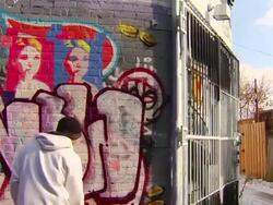 Wide Shot of Graffiti Artist Painting Urban Wall Stock Footage