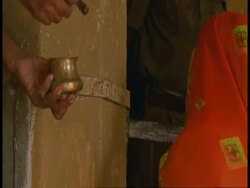 CU hand of Hindu priest annointing people in Hindu Temple, Bandhavgarh National Park, India Stock Footage