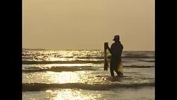 Fishermen in Gabon casting nets News Clip