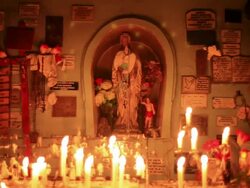 MS Shot of small altar with burning candles  / Isla Quinchao, Isla Grande de ChiloÃŒÂ©, Chile Stock Footage