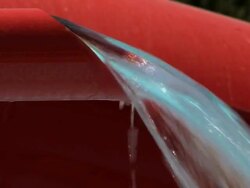 Water jet from red tube; game attraction detail in waterpark Stock Footage