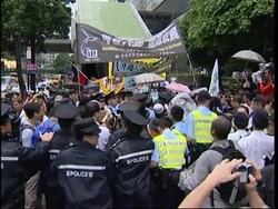 Pro-democracy protesters scuffle with riot police, Falun Gong group marching News Clip