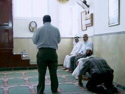 MS PAN Men worshipping in small bright room  / Bethlehem, Palestine Stock Footage