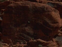 group of climbers on red rock Stock Footage