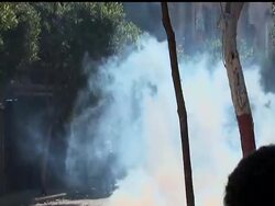 Black-clad riot police in Cairo have been firing rubber bullets at protesters to protect government offices and building walls of concrete on street entrances. Meanwhile, the U.S. is threatening to stop its foreign aid. News Clip