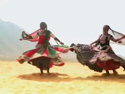 Two women dancing in the desert, Rajasthan, India Stock Footage